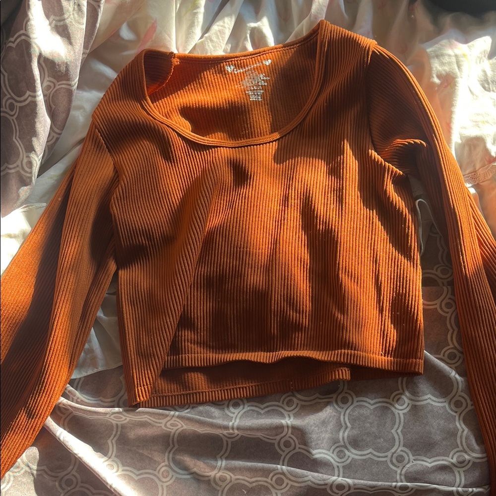 Never worn cropped orange long sleeve, any in m-L, will take lower offers